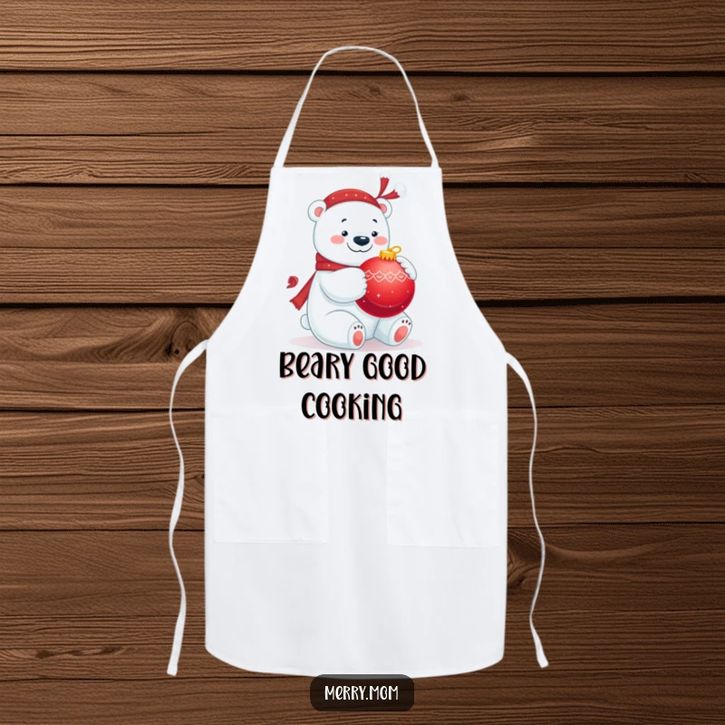 Funny apron featuring a jolly polar bear hugging a big red ornament, great for holiday cooking.