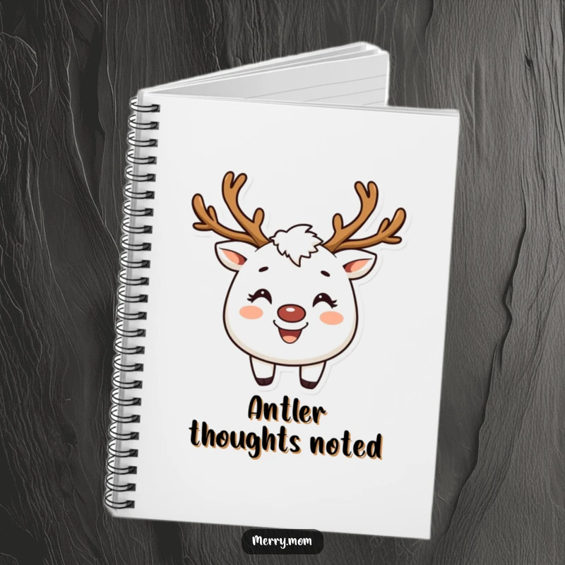 Funny notebook with a creature wearing reindeer antlers and a broad smile, ideal for holiday notes.