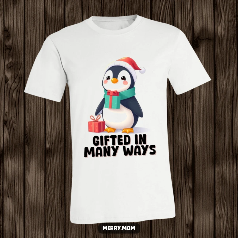 Funny Christmas t-shirt showcasing a cheerful penguin in a small Santa suit, balancing presents on its nose with impressive skill.