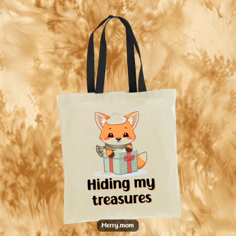Funny tote bag with a playful fox and scarf peeking from behind a snowy gift, ideal for winter use.